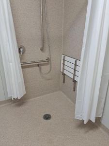 a shower with a shower curtain in a bathroom at Breeze Holiday Parks - Mary River in Marrakai