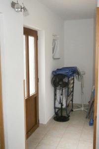 a room with a room with a table and a door at Apartments by the sea Valun, Cres - 8081 in Valun