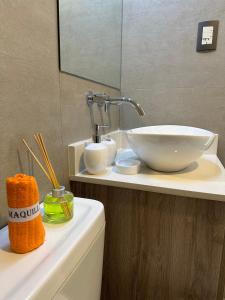 a bathroom with a bowl sink on a counter at Domum 144 2 in San Juan
