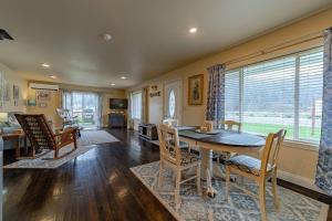 a kitchen and living room with a table and chairs at Elk Meadow Cabins Ranch Site Oreq-A in Orick