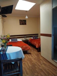 Ένα ή περισσότερα κρεβάτια σε δωμάτιο στο Hospedaje Balcón Cusqueño