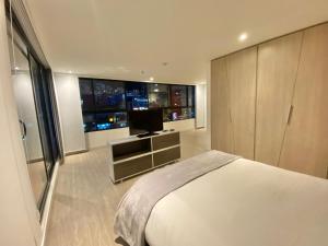 Voodi või voodid majutusasutuse Hermosa Vista en Chapinero cómodo wifi toas