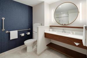 a bathroom with a sink and a mirror at Fairfield Inn & Suites by Marriott Tijuana in Tijuana