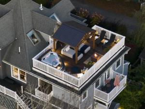 an aerial view of a house with a deck and a swimming pool at Lindenwood Inn in Southwest Harbor