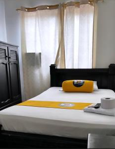 Postel nebo postele na pokoji v ubytování Hotel sol de uraba