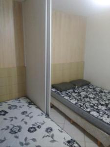 Ένα ή περισσότερα κρεβάτια σε δωμάτιο στο Cond Thermas Place