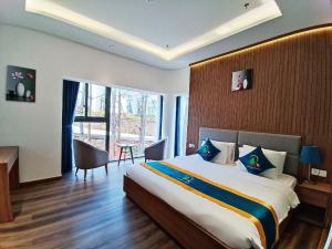 Postel nebo postele na pokoji v ubytování Rung Thong Nui Voi Villa & Resort