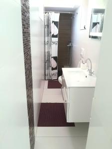 a bathroom with a toilet and a sink and a shower at UNIQUE Apartments Malinska in Malinska +39 photos