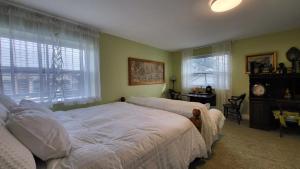 Un pat sau paturi într-o cameră la sweet home