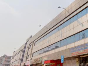 a large building with many windows on a city street at Collection O 9796 Hotel Alekhya Residency in Hyderabad