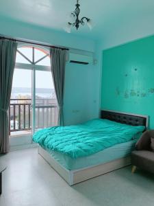 Katil atau katil-katil dalam bilik di 漁人的家Penghu Fisherman House
