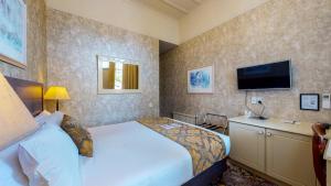 Voodi või voodid majutusasutuse Prince's Gate Hotel toas