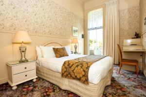 Voodi või voodid majutusasutuse Prince's Gate Hotel toas