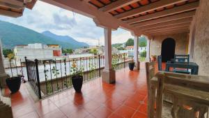 a balcony with a view of a mountain at Casa Miranda in Antigua Guatemala