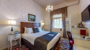 Voodi või voodid majutusasutuse Prince's Gate Hotel toas