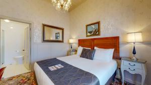 Voodi või voodid majutusasutuse Prince's Gate Hotel toas