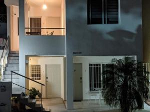a view of a building with a staircase and a door at Hermoso departamento en Cancún YaxBahia 3 in Cancún
