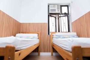 Katil atau katil-katil dalam bilik di Ah Shan Hostel