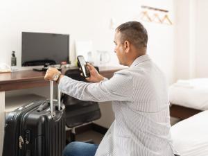 Televiisor ja/või meelelahutuskeskus majutusasutuses Travel Inn Kofu