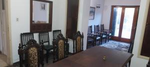 a dining room with a table and some chairs at hostel Paso de los Andes in Córdoba