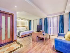 Ένα ή περισσότερα κρεβάτια σε δωμάτιο στο Oasis Hotel, Changsha Auto West Station Business School