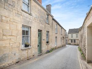 an empty street in an old stone building at Wayside in Painswick