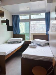 Katil atau katil-katil dalam bilik di Ah Shan Hostel