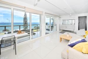 a living room with a view of the ocean at Alexandra Headland Ocean Dream - Stunning View ZA6 in Alexandra Headland