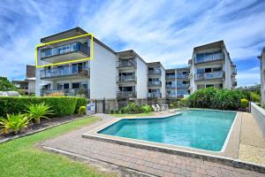 an apartment building with a swimming pool in front of it at Alexandra Headland Ocean Dream - Stunning View ZA6 in Alexandra Headland