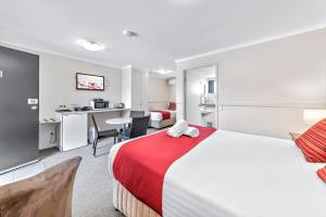 Katil atau katil-katil dalam bilik di Apple & Grape Motel