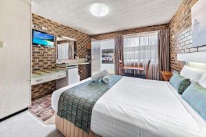 Katil atau katil-katil dalam bilik di Apple & Grape Motel