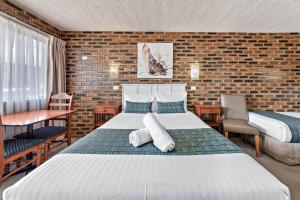 Katil atau katil-katil dalam bilik di Apple & Grape Motel