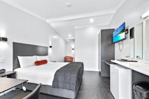 Televisyen dan/atau pusat hiburan di Apple & Grape Motel