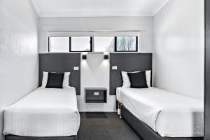 Katil atau katil-katil dalam bilik di Apple & Grape Motel