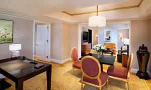 a living room with a table and chairs and a living room at The St. Regis Beijing in Beijing
