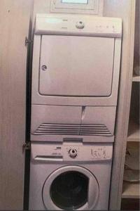 a washing machine and a washer in a room at Beach Apartment with Seaview II in Olympic Beach