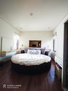 a large bedroom with a large bed in it at Vimala Hills FARLA Villa - 3BR in Gadok 1