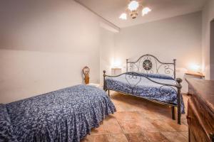 Letto o letti in una camera di Borgo Struginati