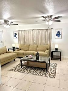 a living room with a couch and a coffee table at Peaceful Home in Central Florida Near Universal in Orlando