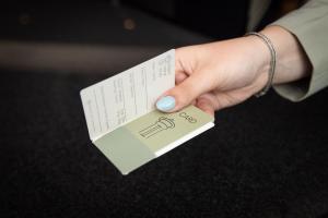 a person holding a card in their hand at Hotel & Restaurant Infinity in Lichtmis +15 photos