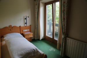 Letto o letti in una camera di Hotel Voglauerhof