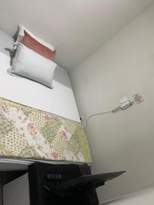 En eller flere senge i et værelse på Flat Aeroporto vitoria