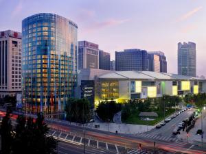 a city with tall buildings and a street with cars at The Ritz-Carlton Beijing, Financial Street in Beijing