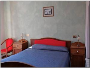 Postel nebo postele na pokoji v ubytování Albergo Miramonti