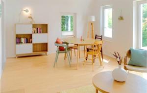 a living room with a table and chairs at Beautiful Home In Morschen With Wifi in Morschen