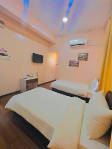 Postel nebo postele na pokoji v ubytování Sipadan Crystal Haven Inn