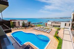 an overhead view of a swimming pool and the ocean at St. Panteleimon Beach Hotel in Nesebar