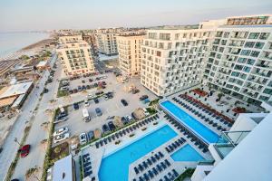 an aerial view of a resort with a pool and buildings at MDApartment in Infinity Beach Resort- Parking in Mamaia