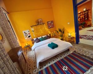a bedroom with a large bed and a mirror at Medusa Home Stay in Amman