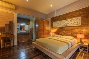 Ένα ή περισσότερα κρεβάτια σε δωμάτιο στο Villa Le Jardin de Bali Abian Saba